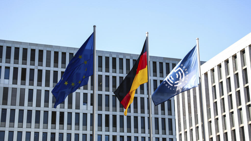 Former German spy chief detained as espionage inquiry widens