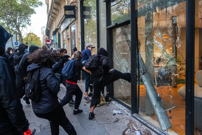 Macron condemns unrest in France and raises possible protest bans