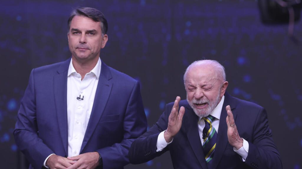 Lula and Flávio Bolsonaro trade attacks in first Brazilian runoff debate